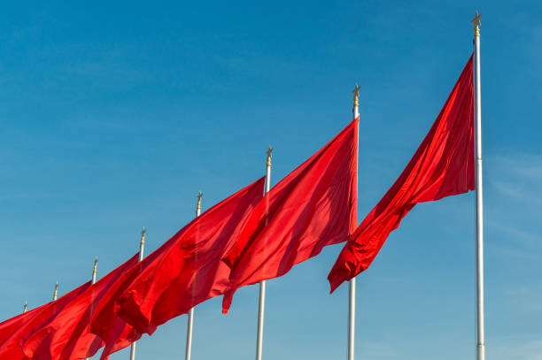 Red banners unfurled in the wind at Tiananmen square in Beijing, China Beijing / China - September 27, 2014: Red banners unfurled in the wind at Tiananmen square ahead of the National Day celebration (65th Anniversary of the Founding of the People's Republic of China). xi jinping stock pictures, royalty-free photos & images