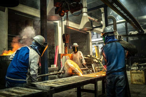 istock Metal industry work - pouring molten metal 1286894774