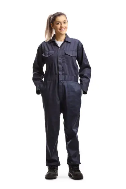 Full length portrait of a female worker in an overall uniform isolated on white background