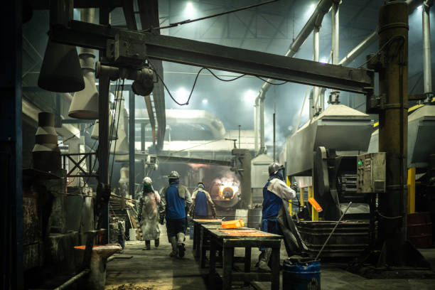 istock Metal industry work - removing hot iron using tweezers 1286895107
