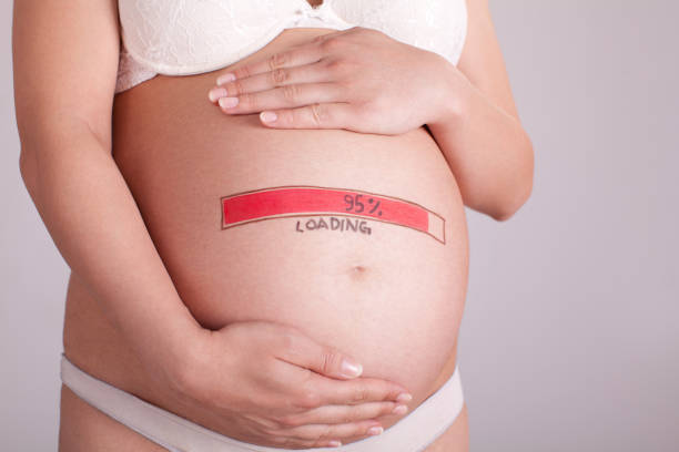 istock Pregnant woman with loading drawing on her abdomen 1286895244