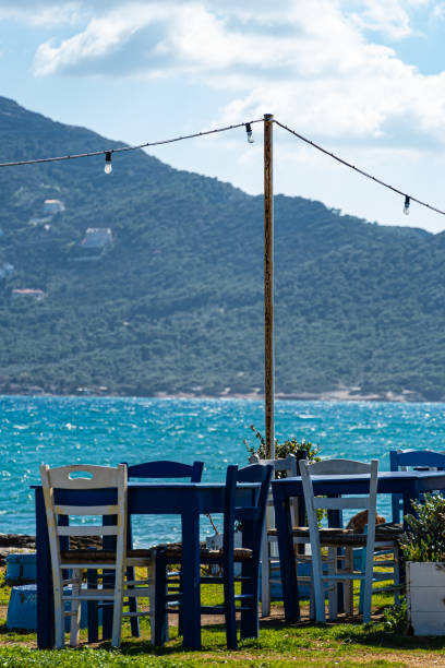 istock chairs and tables on the seaside 1286896329