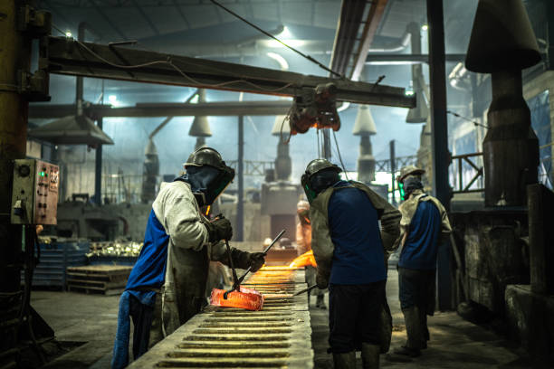 istock Metal industry work - pouring molten metal 1286896638