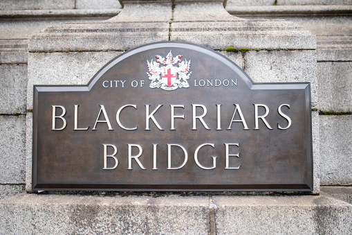 London, UK - September 30, 2020: Picture of The Brown Southwark Bridge Plaque with the City of London Coat of Arms on a gray stone wall