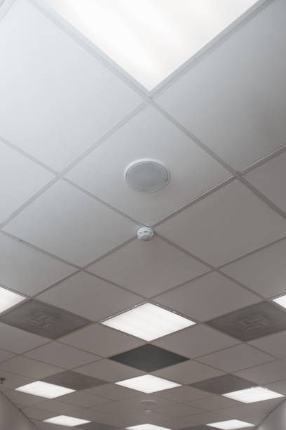 istock Office room ceiling with smoke detector and alarm 1286903520