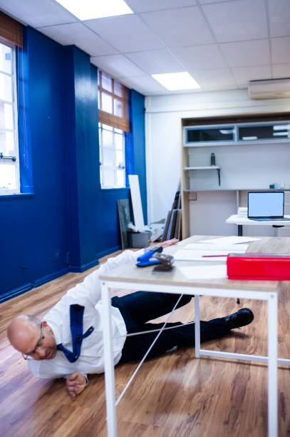 istock Male office employee standing looking at screen hand slips and he falls 5of5 1286904623