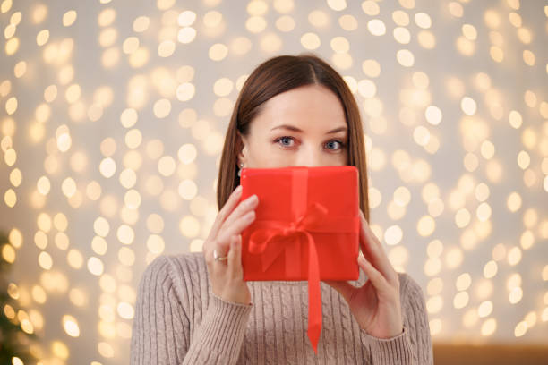 istock Portrait young beautiful woman hold a gift box 1286906709