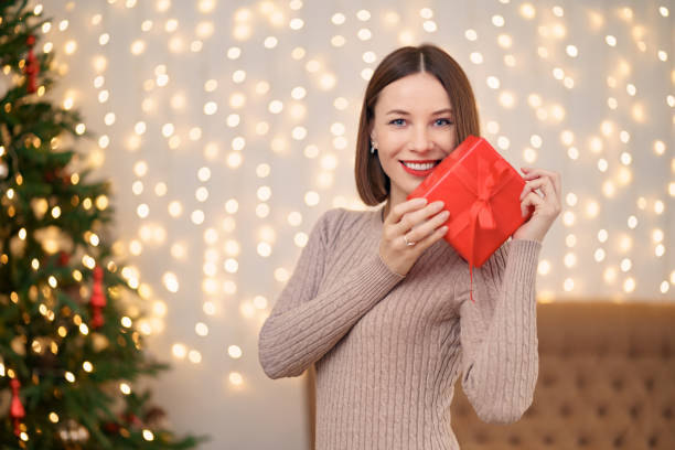istock Portrait young beautiful woman hold a gift box 1286906715