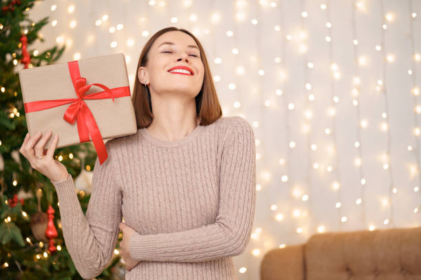 istock Portrait young beautiful woman hold a gift box 1286906732