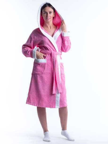 istock woman in a Bathrobe on an isolated white background with a smile on her face. 1286908286