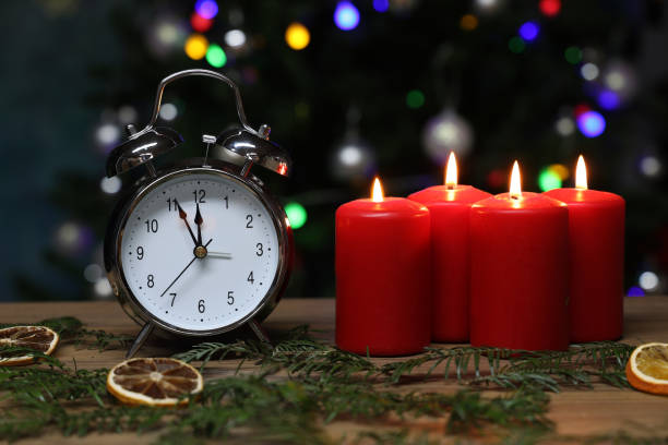 istock New year composition with alarm clock and burning candles 1286908859