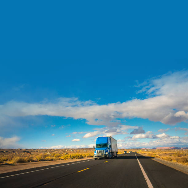 istock Truck with cargo moving fast on a highway in Arizona 1286911350