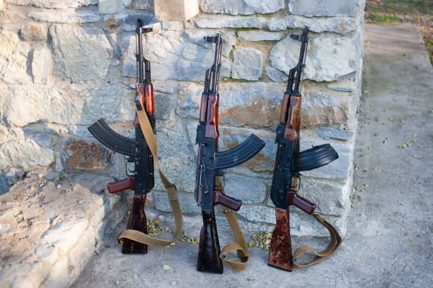 istock Rifles near a stone wall 1286913547