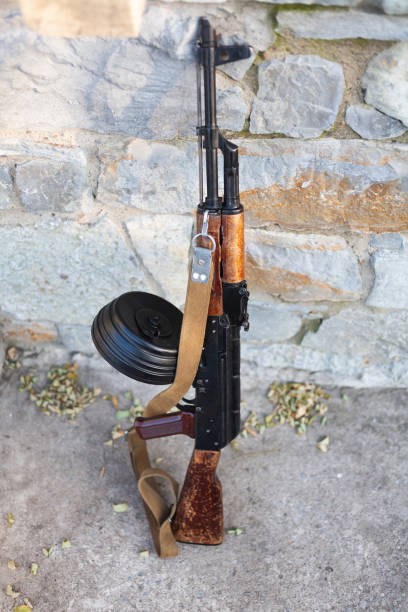 istock Rifle near a stone wall 1286913554