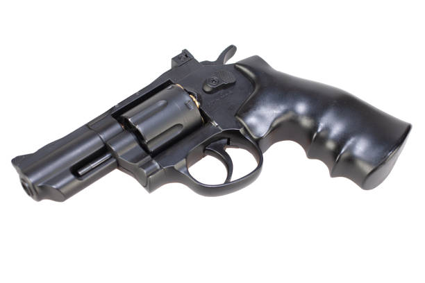istock lock and load revolver with ammunition in cylinder isolated on white 1286914122