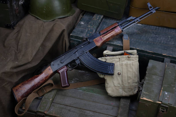 istock AK 47 gun with ammunitions on army box background 1286914484