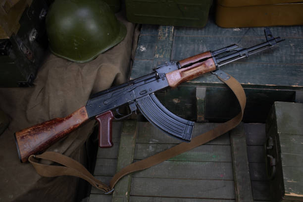 istock AK 47 gun with ammunitions on army box background 1286914489