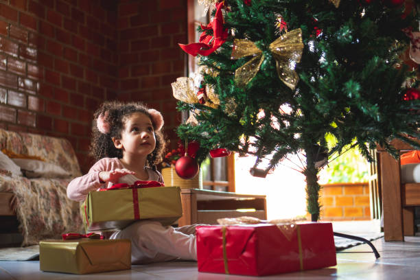 istock Excited girl with christmas present 1286916600