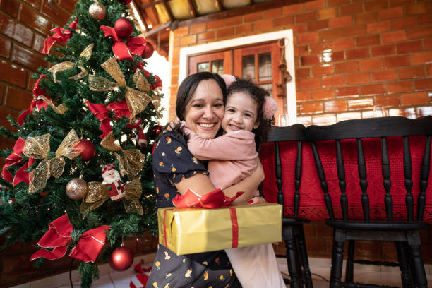 istock Mother and daughter hugging at Christmas 1286917046