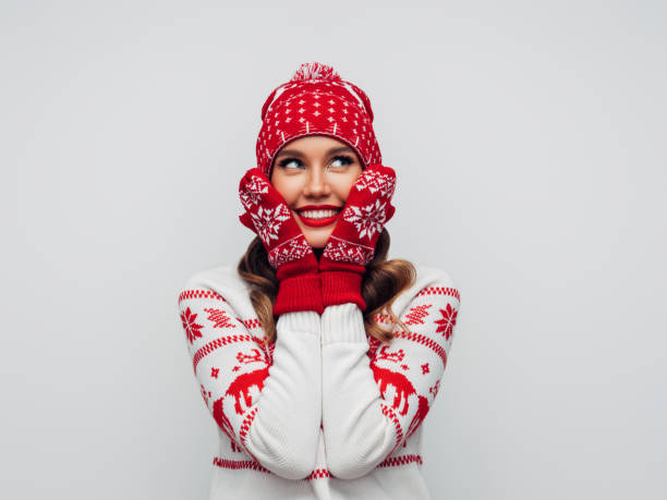 istock Beautiful woman wearing hat and mittens 1286917113