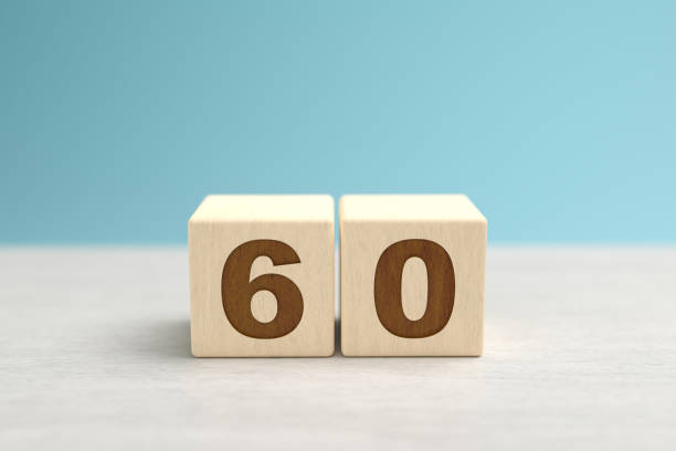 Wooden toy blocks forming the number 60. stock photo