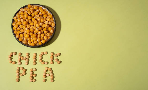 istock Chickpeas in small brown ceramic plate bowl isolated on a green olive background. vegetarian dish. style minimalism. on bowl copy space - concept healthy vegan diet protein organic food dish 1286919478