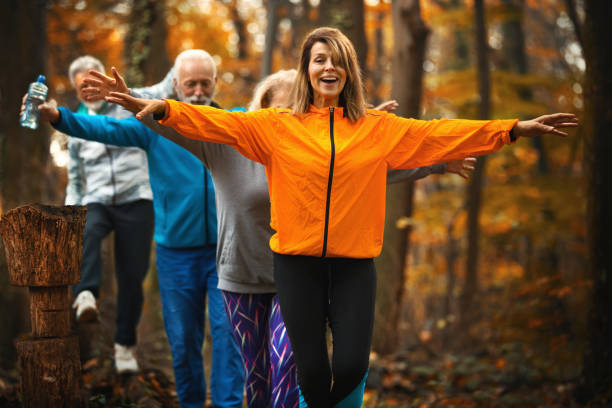 istock Group of mature folks walking through a forest. 1286924893