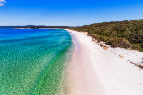 D JBay hyams wave far Smooth wave rolling on white sand dune of Hyams beach in Jervis bay - elevated aerial view. tidal inlet stock pictures, royalty-free photos & images