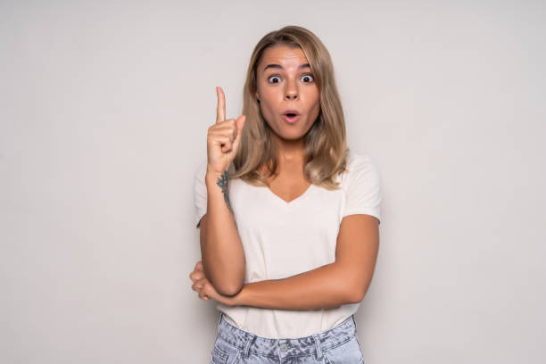 istock Young woman having a great idea isolated over white background 1286936110