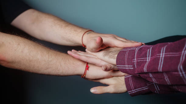 istock Cyan studio is placed on top of multiple hands in the background, Success and team concept 1286936834