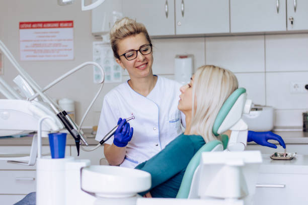 istock Happy female dentist working at her office 1286940640