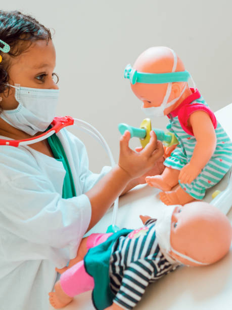 istock A little girl playing the doctor 1286940694