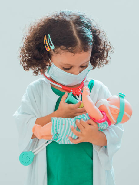 istock A little girl playing the doctor 1286940749