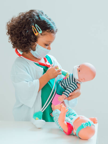 istock A little girl playing the doctor 1286940878
