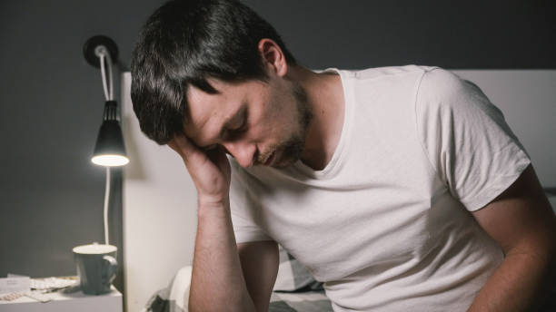 istock A young Caucasian man is sick and have his body temperature measured with an electronic thermometer. High temperature concept. Man feels badly ill. Infection, coronavirus virus and covid 19 1286941394