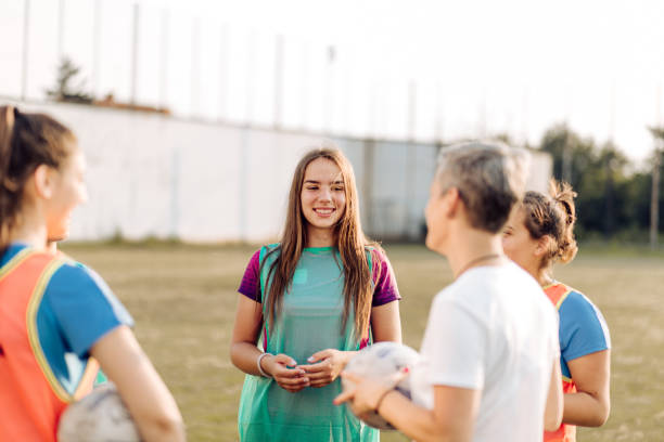 istock Female rugby team taking a break during their training 1286942436