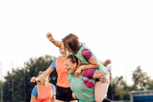istock Female rugby team cheering for a point 1286942452