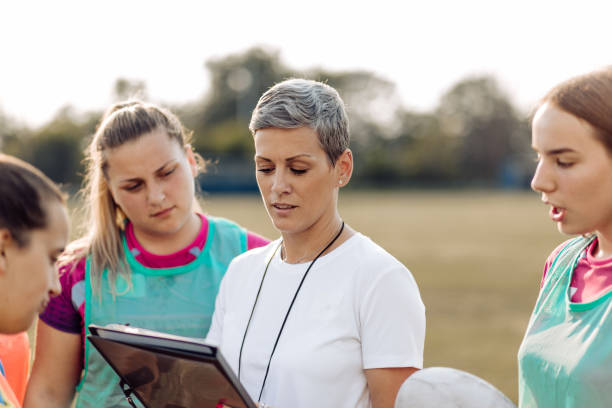 istock Coach working with her female team on a playing strategy 1286942457