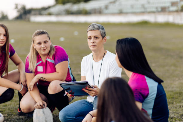 istock Coach taking a break with her team to make a playing strategy 1286942462