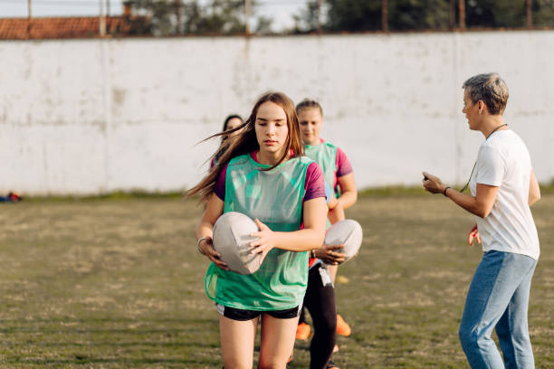istock Female rugby team having a training with their coach 1286942473
