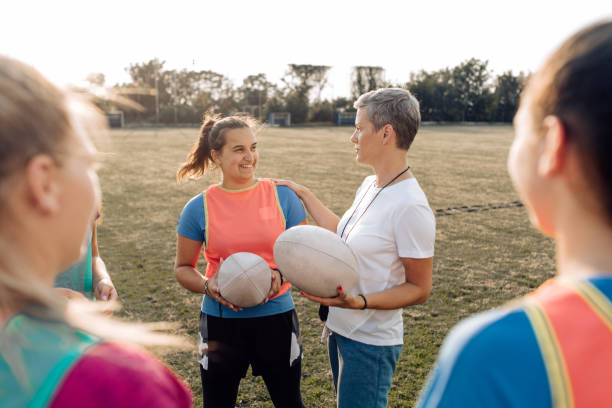 istock Female rugby team is having a great relationship with their trainer 1286942478