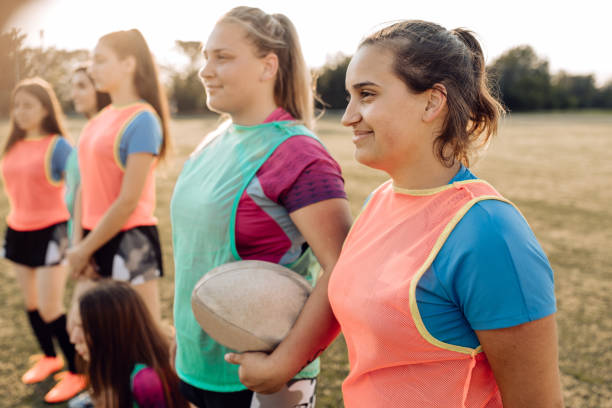 istock Female rugby team starting their training on the field 1286942502