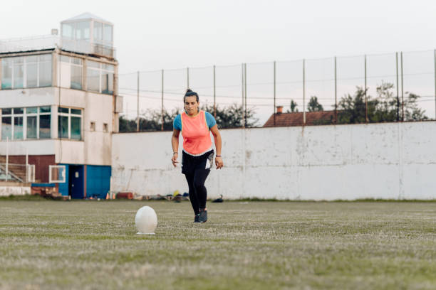 istock Female rugby player tacking a shot 1286942530