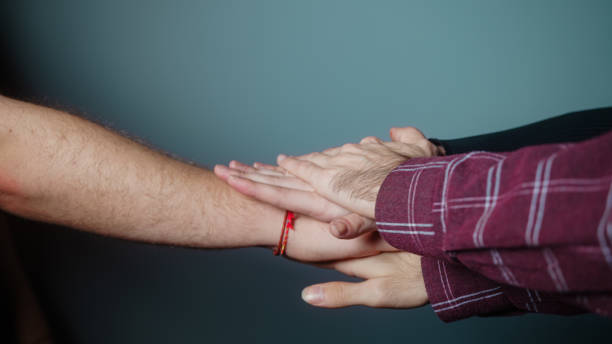 istock Cyan studio is placed on top of multiple hands in the background, Success and team concept 1286948323