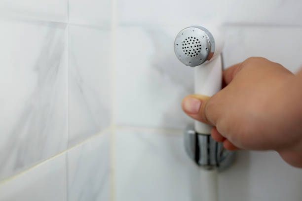 istock White handheld bidet sprayer in toilet bathroom 1286950017