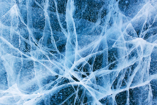 istock Beautiful blue ice of Lake Baikal with cracks. 1286952779
