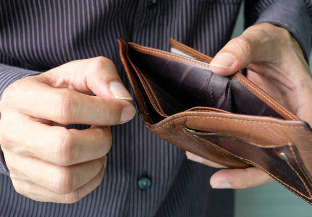 istock The young man's hand opened his wallet without money. 1286956952