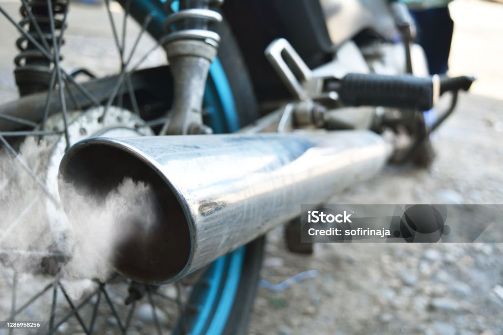 Air pollution from vehicle exhaust pipe close up Exhaust Pipe Stock Photo