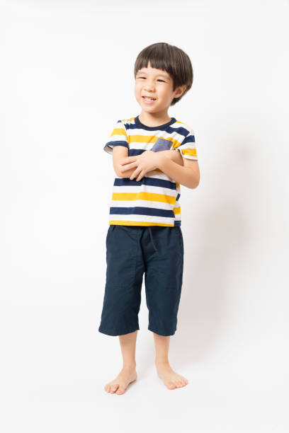 istock Cute Asian boy laughing and smiles isolated on white background. 1286961742