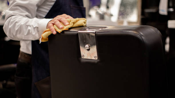istock Elderly barber cleans barber's chair 1286966989